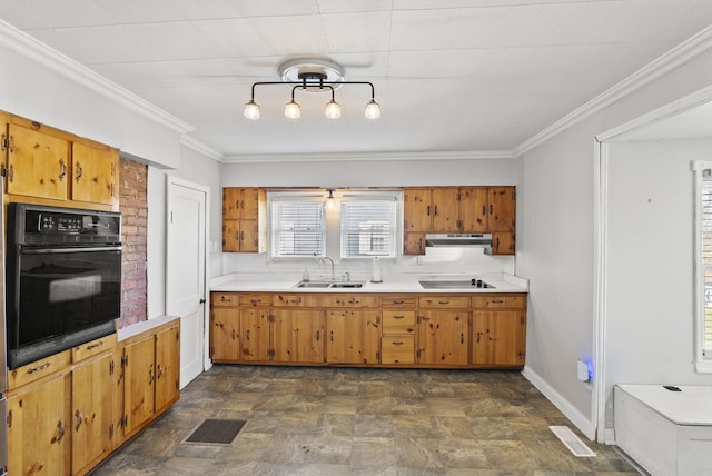 kitchen with visible vents, a sink, black appliances, light countertops, and under cabinet range hood