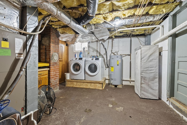 basement with washer and dryer and electric water heater