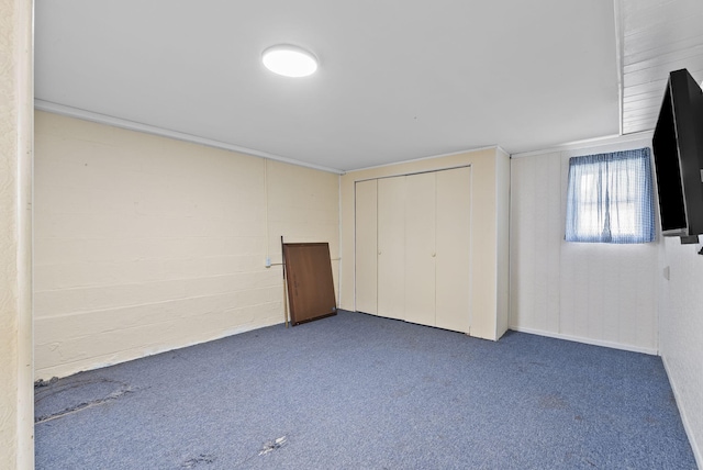 unfurnished bedroom with a closet and carpet