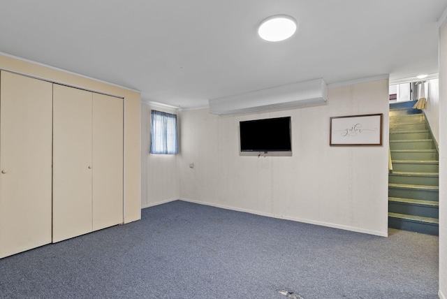 basement with carpet flooring, crown molding, and stairs