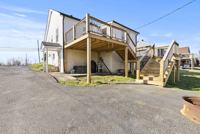 exterior space featuring a deck and stairway