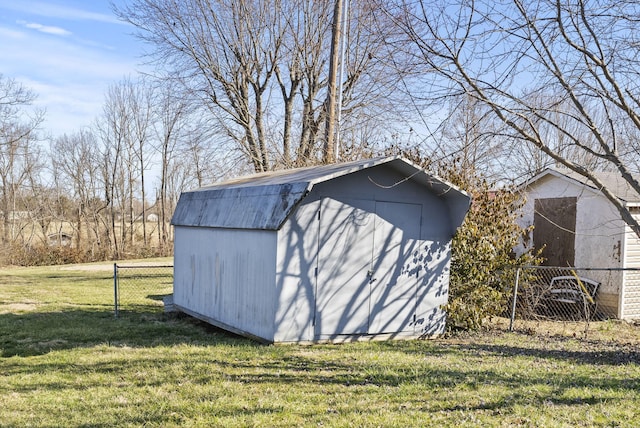 view of shed with fence