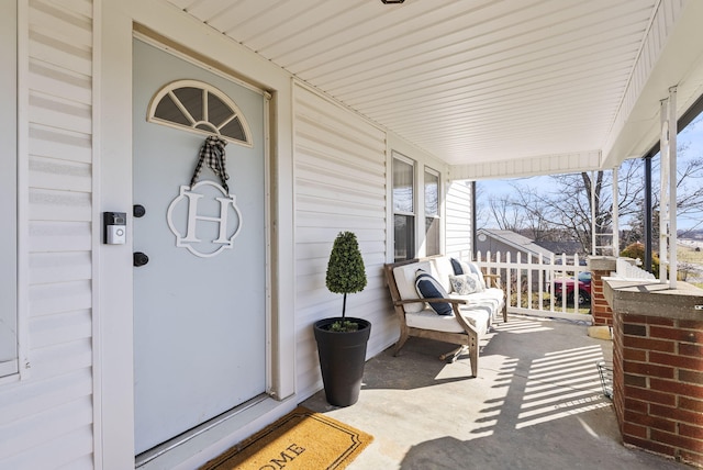 entrance to property with covered porch