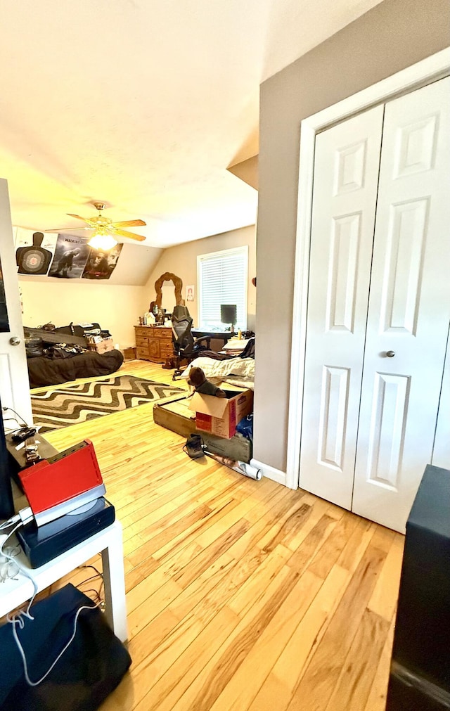 interior space with lofted ceiling and wood finished floors