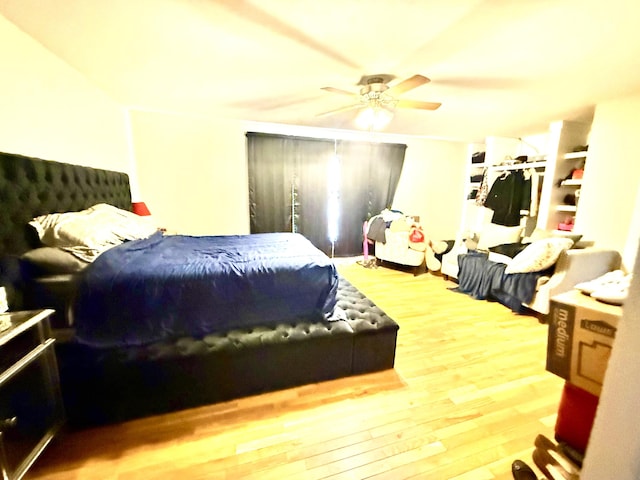 bedroom featuring ceiling fan and wood finished floors