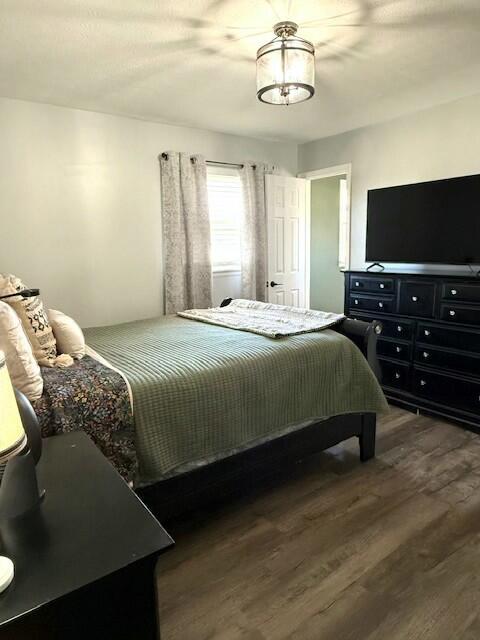 bedroom with wood finished floors