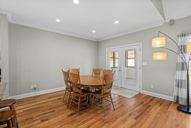 dining room featuring recessed lighting, french doors, crown molding, light wood finished floors, and baseboards