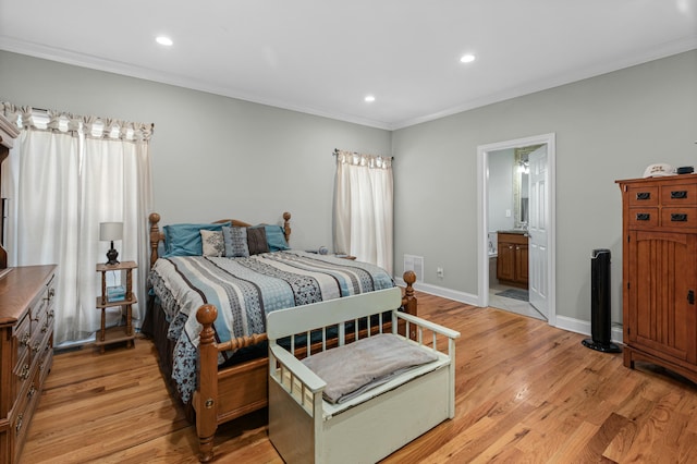 bedroom featuring baseboards, light wood finished floors, recessed lighting, ornamental molding, and ensuite bathroom