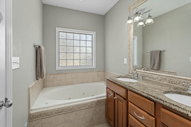 full bath with double vanity, a whirlpool tub, and a sink