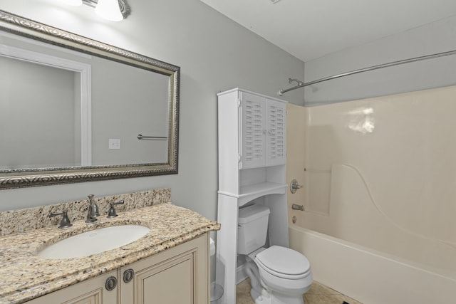 bathroom with tile patterned floors, toilet, shower / washtub combination, and vanity