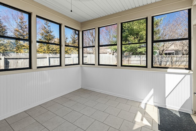 unfurnished sunroom featuring a healthy amount of sunlight