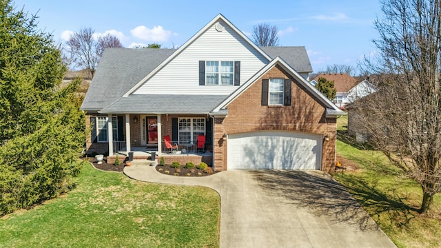 view of front of house featuring a front lawn, covered porch, concrete driveway, an attached garage, and brick siding