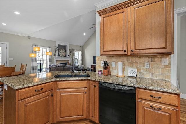 kitchen with open floor plan, dishwasher, a fireplace, a peninsula, and a sink