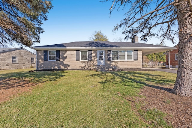 single story home featuring an attached carport, a front yard, entry steps, and a chimney