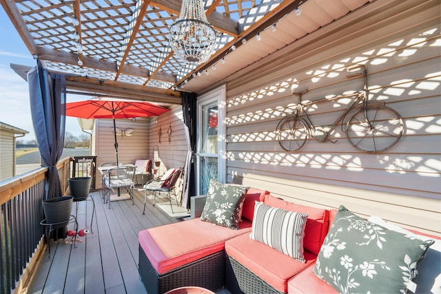 wooden deck with an outdoor living space and a pergola