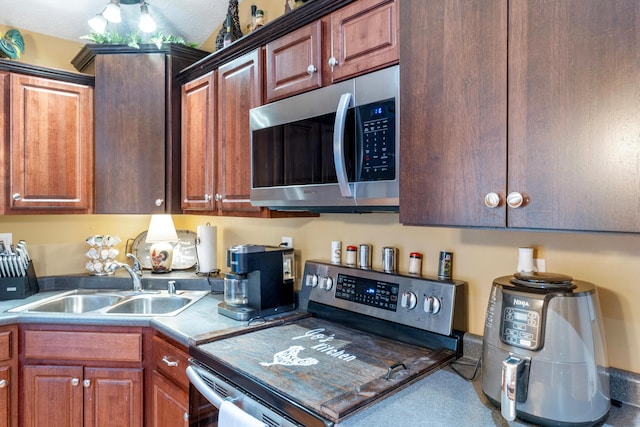 kitchen with stainless steel appliances and a sink