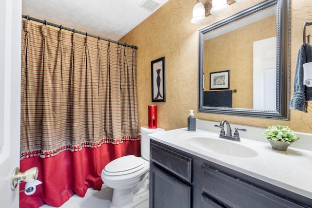 bathroom featuring visible vents, a textured wall, toilet, a textured ceiling, and vanity