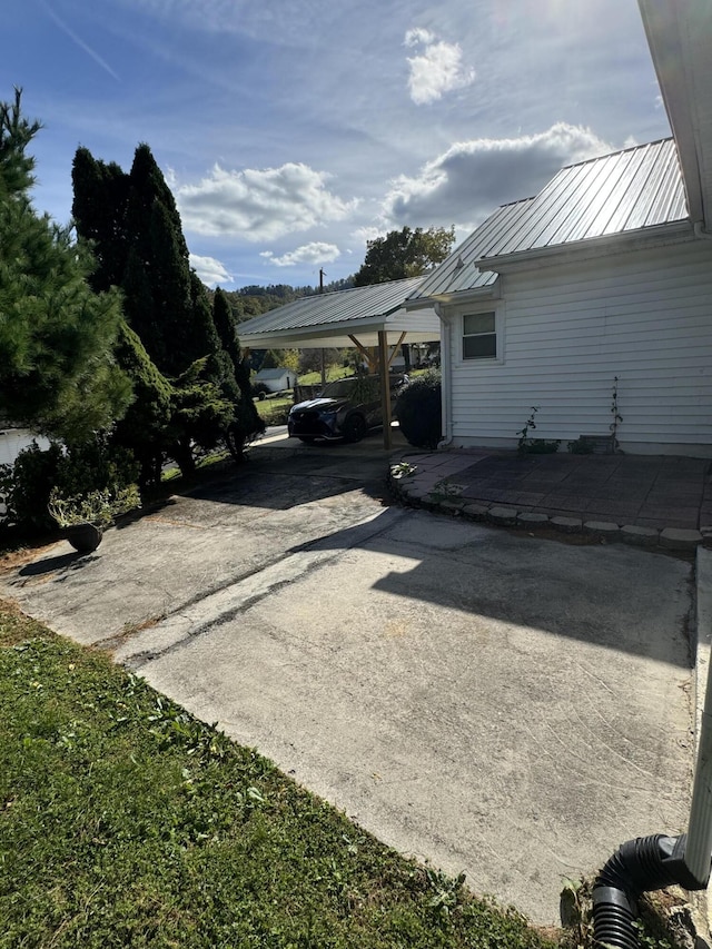 exterior space with a carport