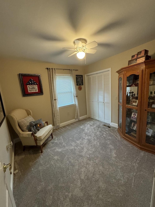 unfurnished room featuring carpet flooring, ceiling fan, and baseboards