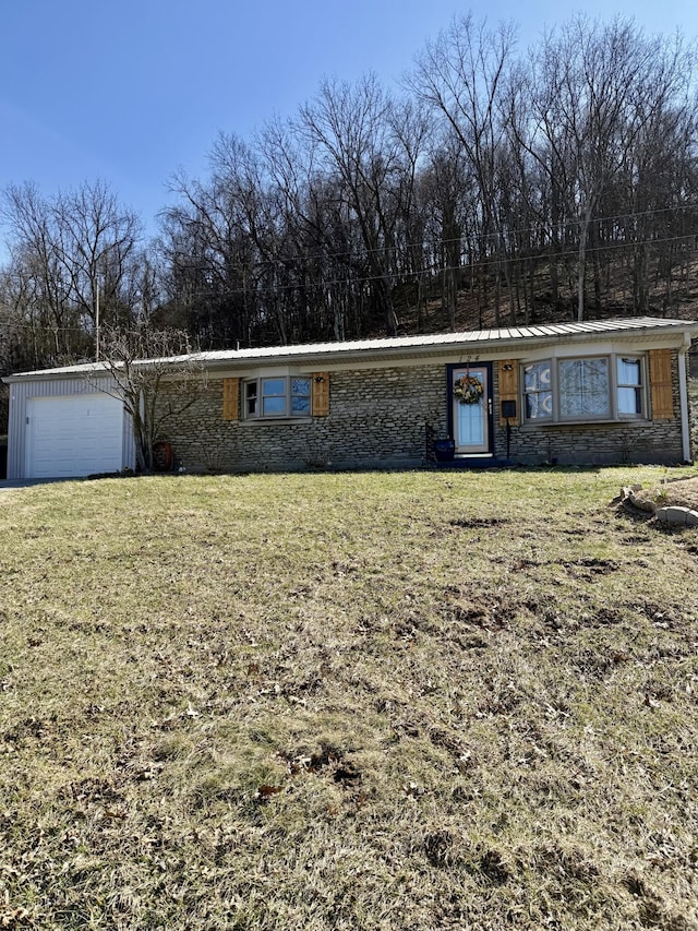 view of front of home featuring a garage and a front yard