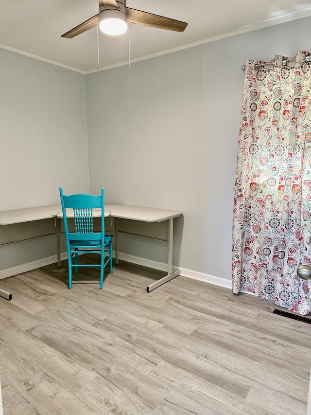 bedroom with a ceiling fan, baseboards, ornamental molding, and wood finished floors