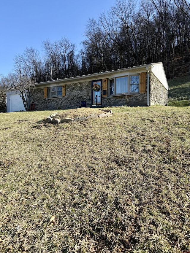 view of front of house featuring a front yard and stone siding