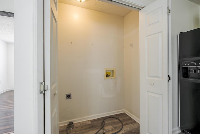 clothes washing area featuring hookup for a washing machine, dark wood-style floors, laundry area, electric dryer hookup, and a textured ceiling