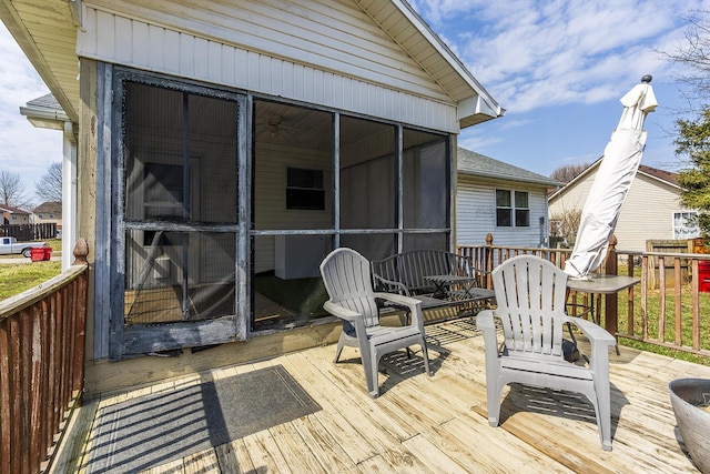 wooden terrace with a sunroom