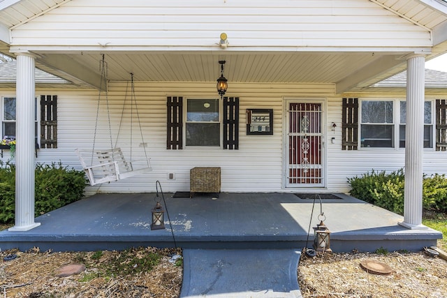 entrance to property with a porch