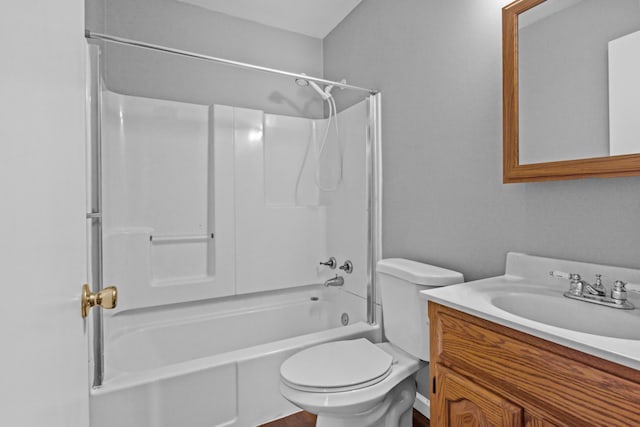 bathroom featuring toilet, vanity, and bathtub / shower combination