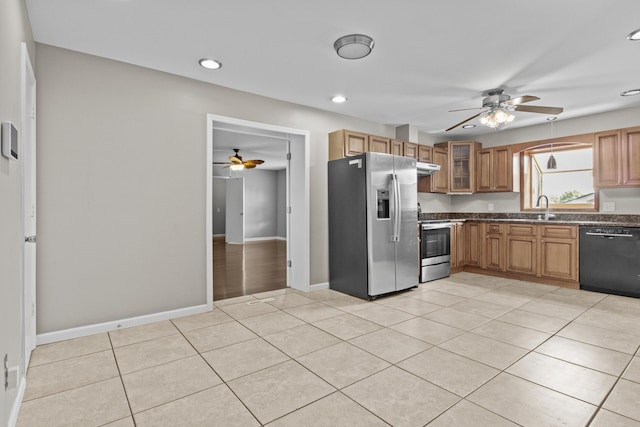 kitchen featuring a ceiling fan, light tile patterned flooring, a sink, under cabinet range hood, and appliances with stainless steel finishes