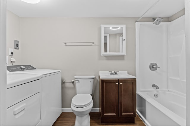 bathroom with vanity,  shower combination, wood finished floors, and independent washer and dryer