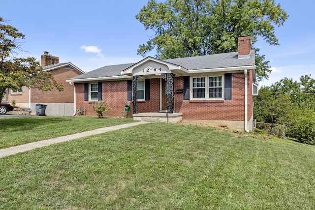 single story home featuring brick siding, a chimney, a front lawn, and a shingled roof