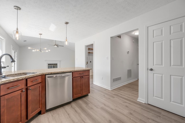 kitchen with light stone countertops, visible vents, light wood-style flooring, a sink, and dishwasher