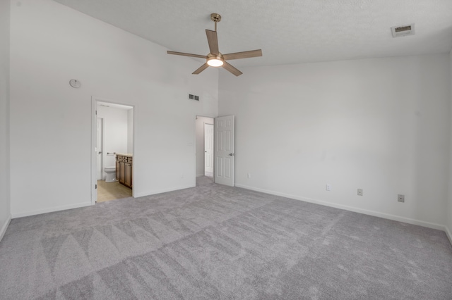 unfurnished bedroom featuring light colored carpet, visible vents, and baseboards