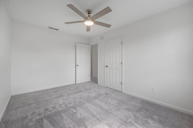 unfurnished bedroom featuring visible vents, carpet floors, baseboards, and ceiling fan