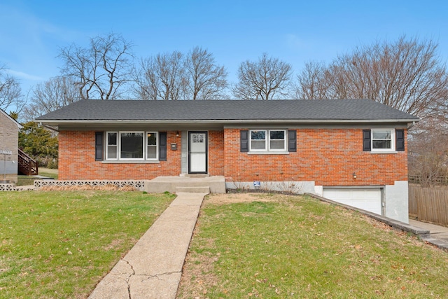 single story home with brick siding, an attached garage, a front lawn, and fence