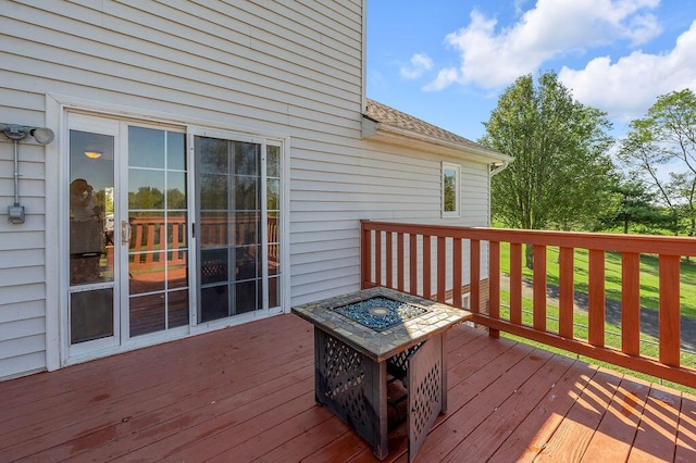 deck with an outdoor fire pit