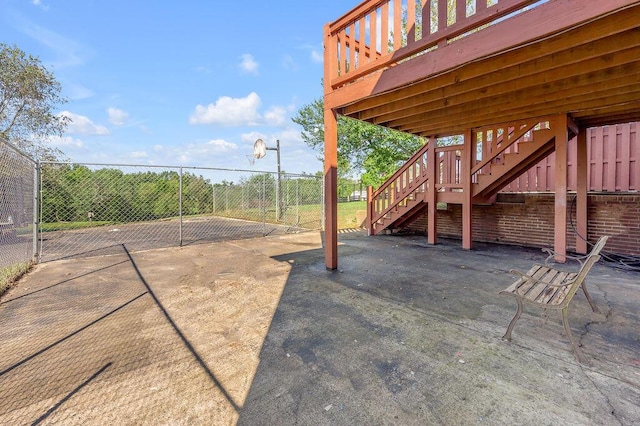 exterior space featuring stairway and fence