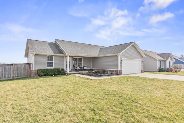 single story home featuring a front yard, fence, concrete driveway, a garage, and brick siding