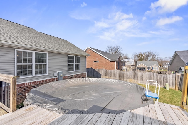 deck featuring a residential view and a fenced backyard