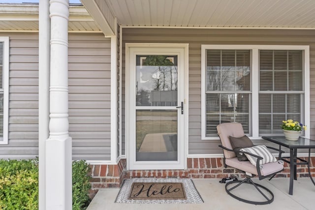 doorway to property featuring a porch