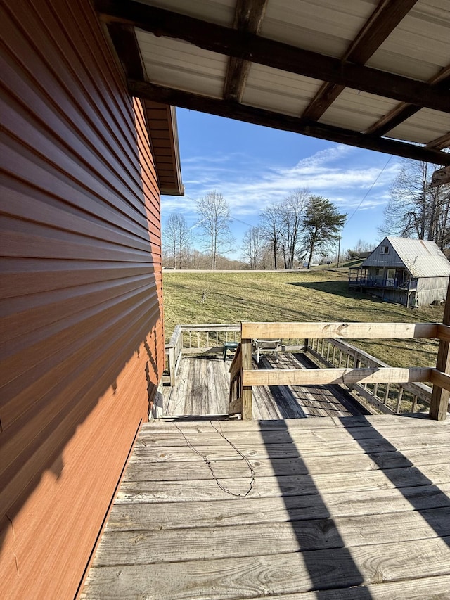 wooden deck with a yard