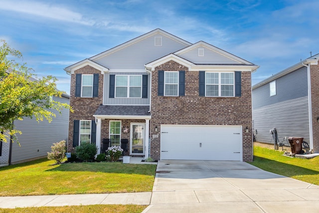 traditional home featuring brick siding, an attached garage, concrete driveway, and a front yard