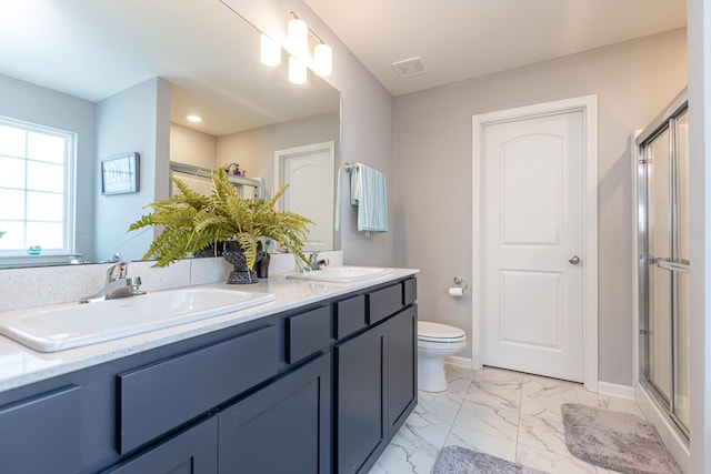 full bath with a stall shower, visible vents, marble finish floor, and a sink