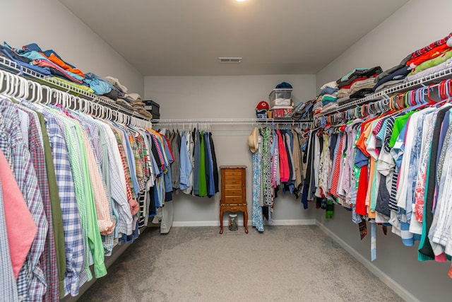 spacious closet featuring visible vents and carpet