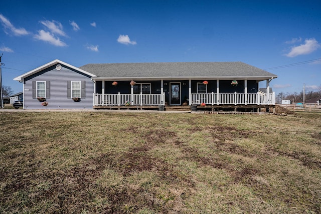 single story home featuring covered porch, a front yard, and a shingled roof