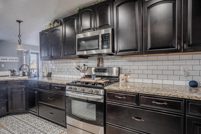1204 Meadow Brook Dr, Lawrenceburg, KY 40342 - kitchen with a sink, decorative light fixtures, appliances with stainless steel finishes, decorative backsplash, and light stone countertops