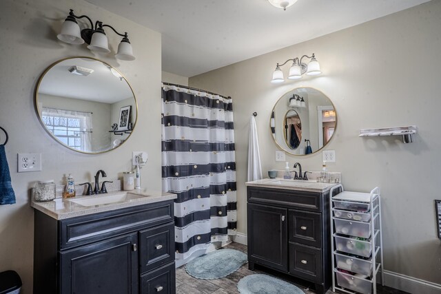 1204 Meadow Brook Dr, Lawrenceburg, KY 40342 - bathroom featuring two vanities, baseboards, and a sink