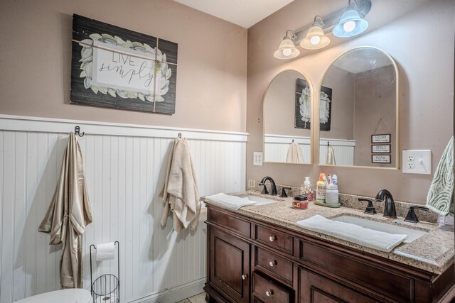 1204 Meadow Brook Dr, Lawrenceburg, KY 40342 - bathroom with a sink, a wainscoted wall, and double vanity